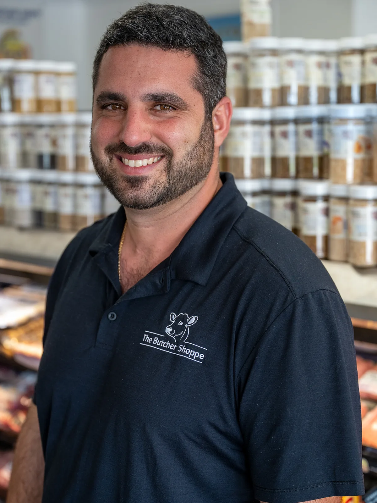 A butcher working behind the counter
