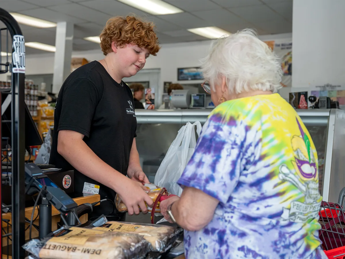 A team member serving a longtime customer