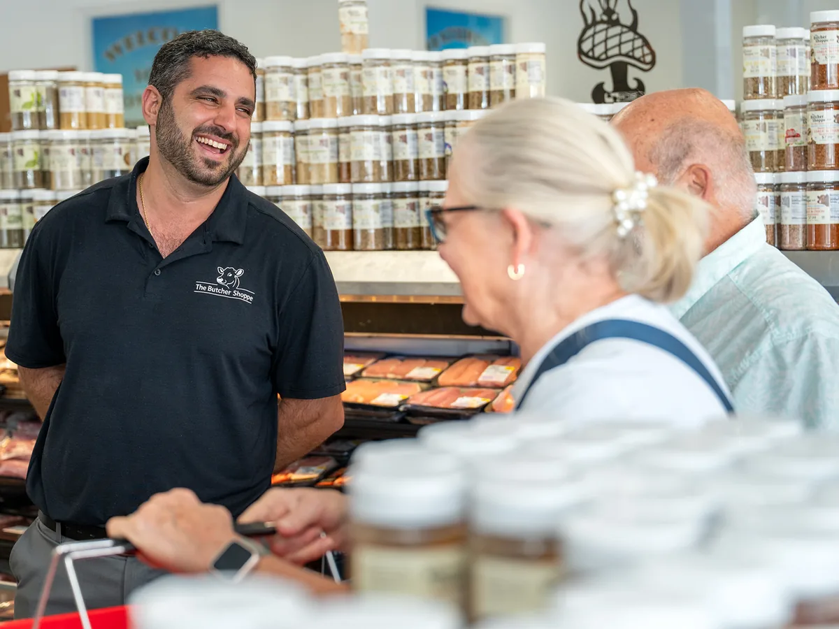 A member of the team serving customers at the counter