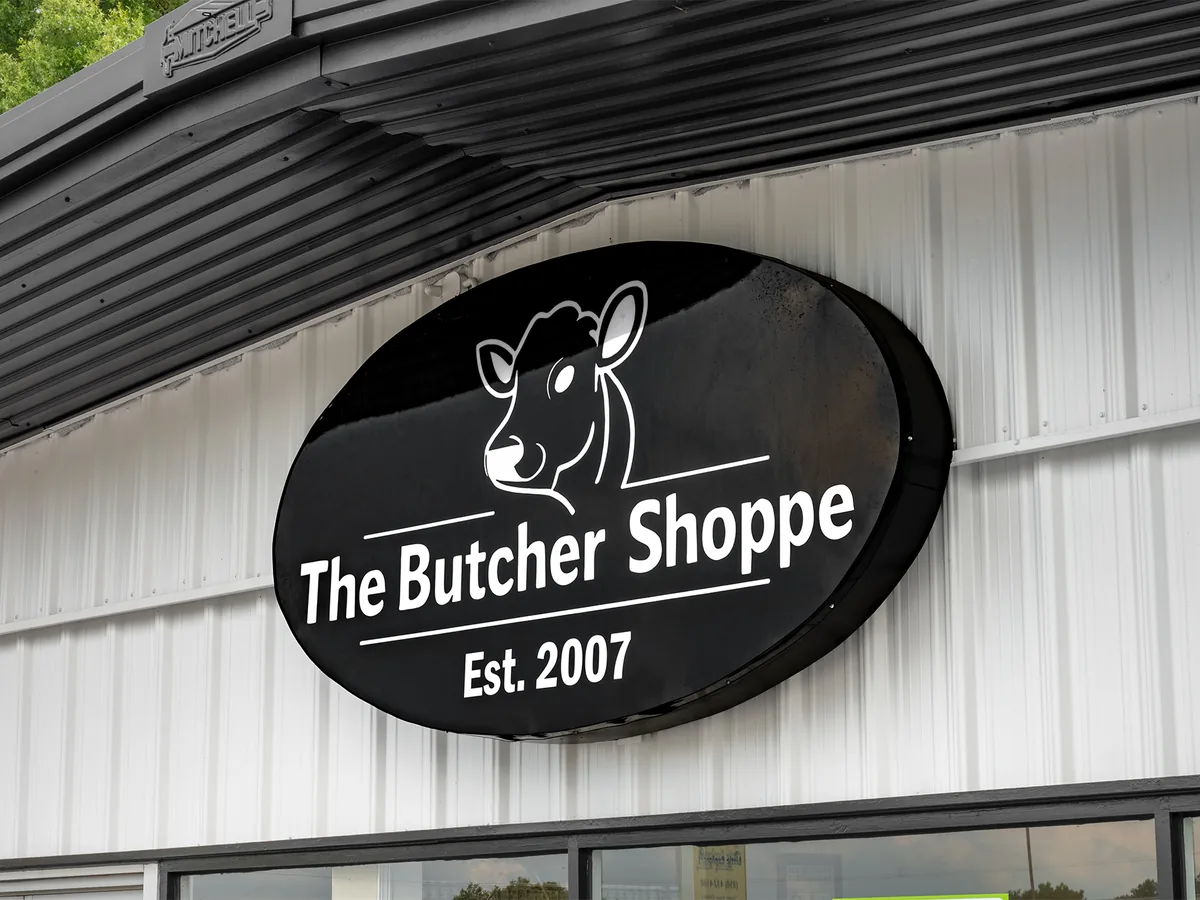 The Butcher Shoppe oval sign on the building
