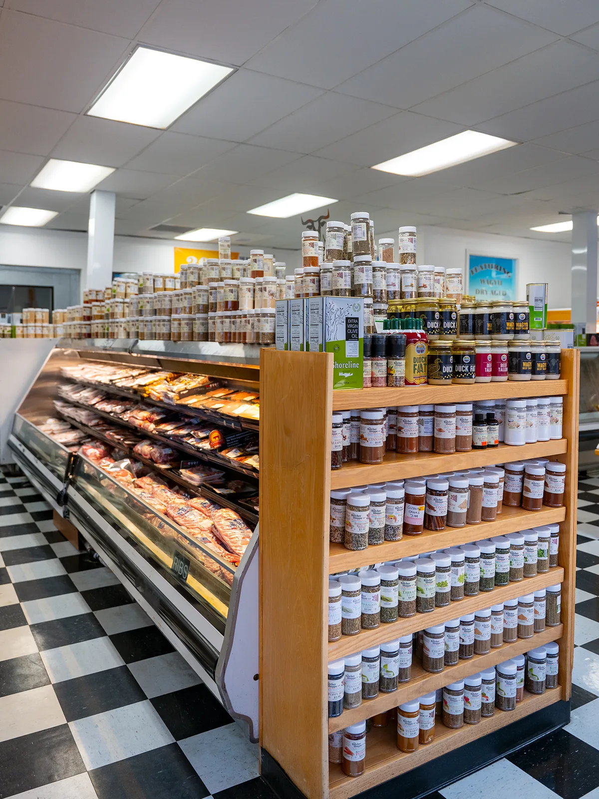 Shelves of premium rubs, sauces, and seasonings